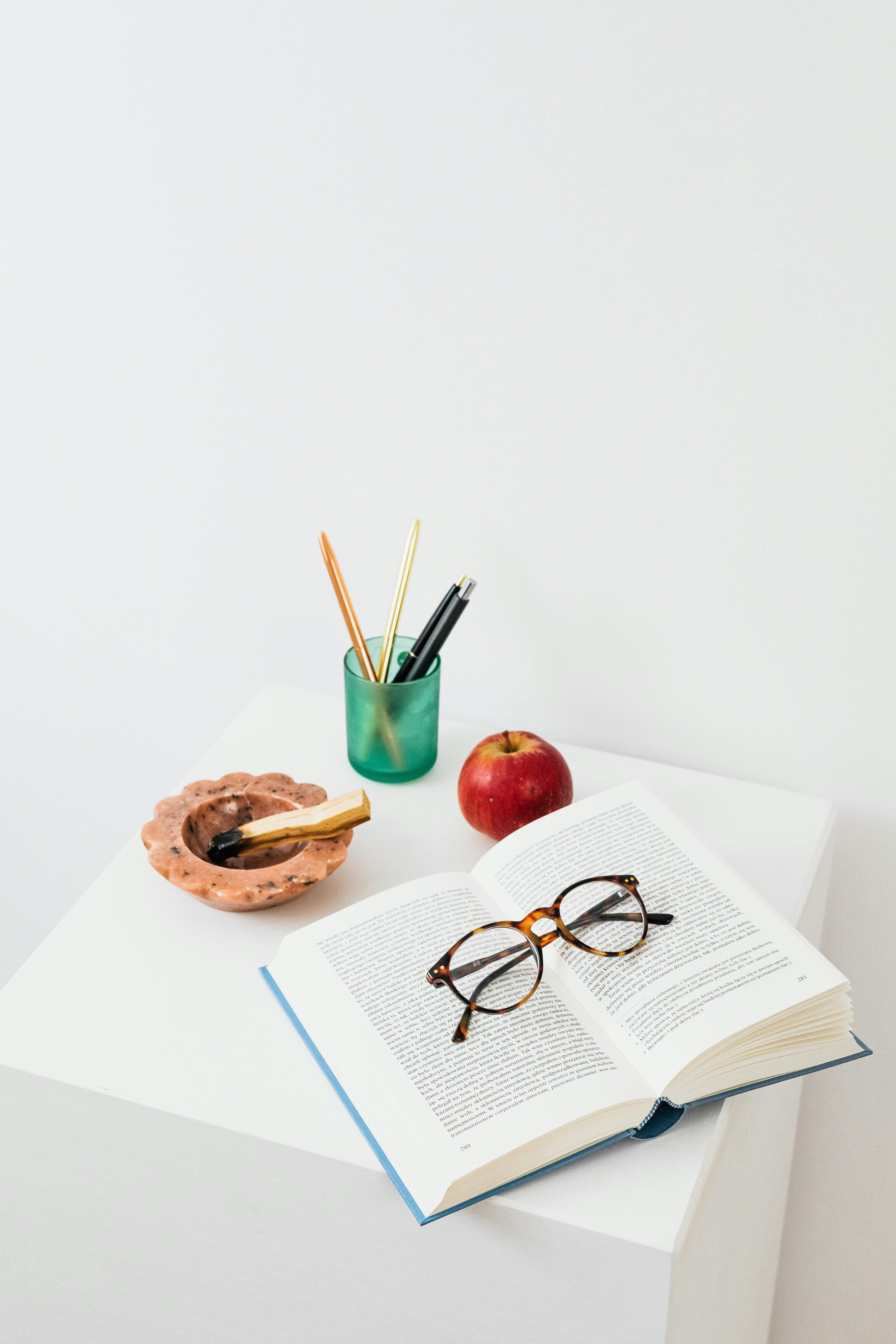 Desk with an apple and books